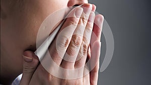 Girl coughs and covers her mouth with napkin. Colds, flu, laryngitis, tuberculosis, asthma, bronchitis, allergies