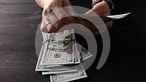 Girl Counting One Hundred Dollar Bills