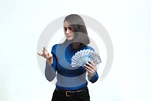 Girl counts Kazakhstan money on a white background