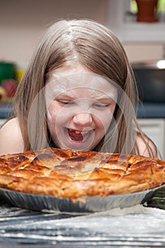 Girl covered in flour laughing