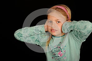 Girl covering ears