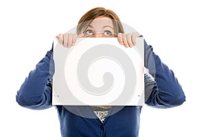 Girl covering face with blank note card