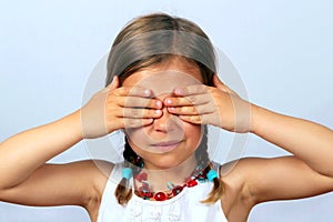 Girl covering her eyes