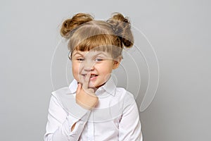 Girl covering her mouth with her finger