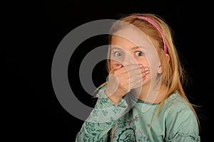 Girl covering mouth