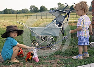 Girl in a cow-boy hat and curly boy (2)