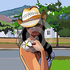 Girl in a cowboy hat with a flower frangipani