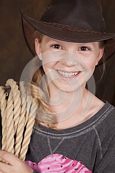 Girl cowboy hat rope smile close