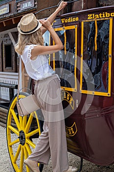 Embrace the Wild West: Woman on a Cowboy Wooden Wagon in El Paso