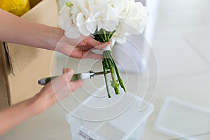 Girl creates a white bouquet