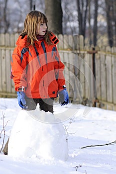 Girl creating snowball