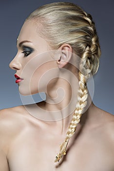 Girl with creative make-up and hair-style