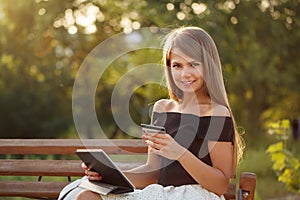 Girl with credit card and tablet pc.