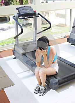 Girl cries at a sports training apparatus
