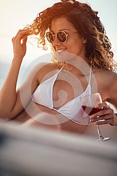 Girl on cruise vacation enjoying in wine