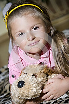 Girl with cuddly toy