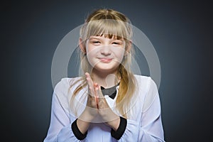 Girl cunning, studio photo isolated on a gray background