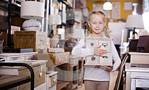 girl with curbstone in furniture store