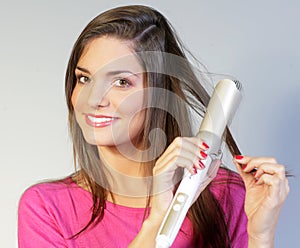 GIRL CURLING HER HAIR