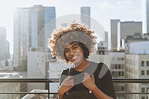 Girl with curly hair at a LA rooftop