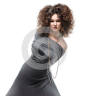 Girl with a curly hairstyle, modern make-up and carnivore look