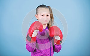 Girl cute boxer on blue background. With great power comes great responsibility. Contrary to stereotype. Boxer child in