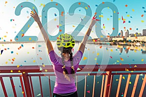 Girl cyclist in a helmet at the finish