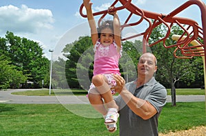 Girl and Dad in a playground