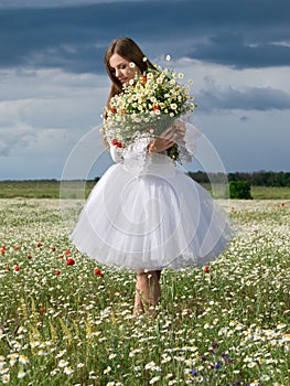 Girl in daisy field