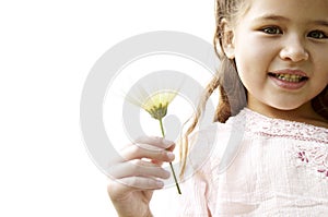 Girl with daisy in park.