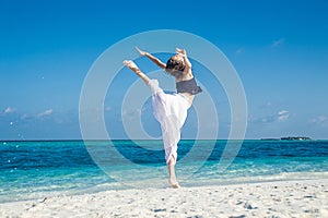 Girl dance at tropical beach