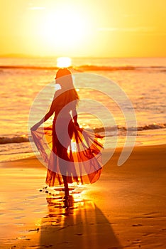 Girl dancing on the beach at sunset,mexico 2