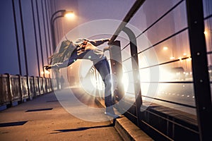 Girl dancing on bridge