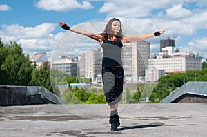 Girl dancing hip-hop over urban landscape