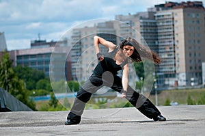 Girl dancing over urban city