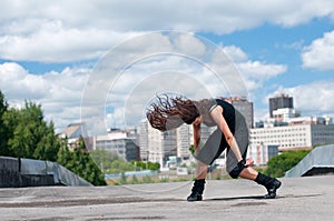 Girl dancing over urban landscape