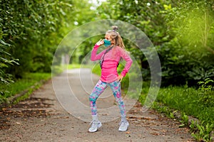 Girl dancing in the street. Girl rejoices at the end of quarantine. Happy girl rejoices at the end of coronavirus