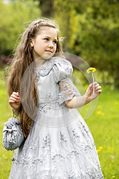 Girl with a dandelion in her hand