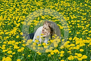 Girl on the dandelion lawn