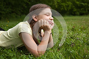 Girl day dreaming in nature