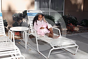 Girl on deck lounge chair