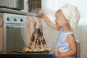 Girl decorating a hot chocolate volcanoe cake
