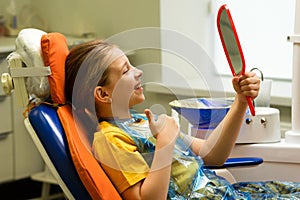 Girl on dental appointment. Regular check up teeth