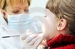 Girl at a dentist examination