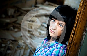 Girl in a destroyed building