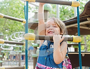 Girl developing dexterity at playground photo