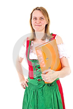 Girl in dirndl carrying orange ring binder