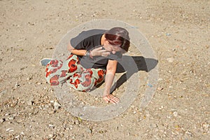 Girl on dirt road that suddenly suffers a respiratory asthma attack