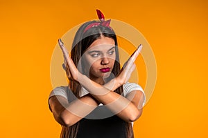 Girl disapproving with no crossing hands sign make negation gesture