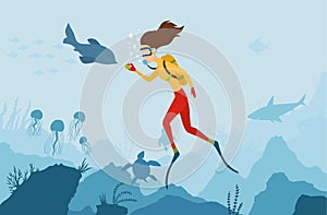 The girl diver playing with a dolphin. Scuba Diver. Underwater world. Girl dive on a coral reef. Summer vacation, sport